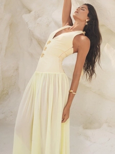 Pale yellow V-neck maxi dress featuring golden starfish accents and a pleated chiffon skirt