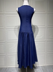Detailed back view of sleeveless denim maxi dress with pleated waist and hidden zipper