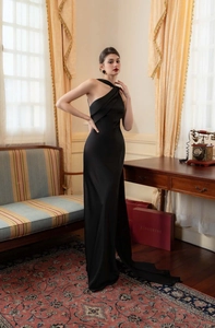 Detailed view of the elegant black satin evening gown featuring an asymmetrical one-shoulder knot