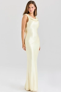 Close-up of elegant champagne satin cowl neck dress with sleeveless design details