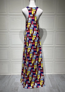 Detail view of colorful geometric print and racerback design on women's maxi dress