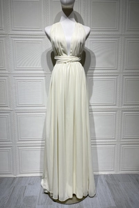 Detail of elegant halter neck maxi dress featuring cross waist design and pleated chiffon skirt