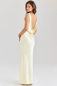 Detail of elegant backless cream satin maxi dress with draped cowl back and floor-length hem