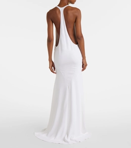 Elegant white backless maxi dress with cross neck strap and slim fit silhouette