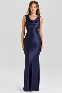 Close-up of elegant navy blue satin evening dress showing the cowl neck and smooth texture