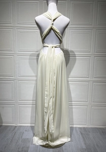 Detail view of the back criss-cross tie and elegant pleats on this halter maxi dress
