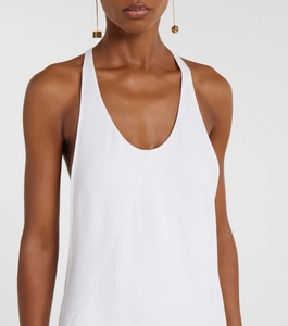 Close-up of white sleeveless dress with geometric stitching and elegant U-neckline