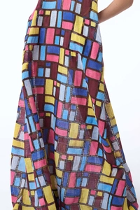 Detailed close-up of geometric color block print and linen texture on sleeveless maxi dress