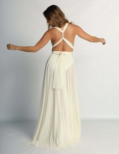 Detail of cream halter dress showing multi-way tie back and pleated chiffon skirt
