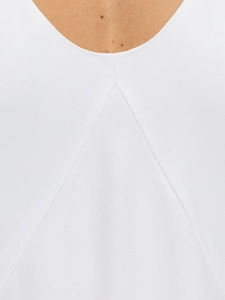 Detailed close-up of the white dress back neckline featuring a professional inverted pleat