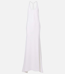 Close-up of elegant white halter-neck evening gown with fluid drape and slim-fit tailoring