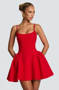 Detailed view of the red strapless mini dress with structured flared skirt and premium fabric
