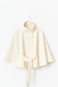 Detail of high collar and round buttons on elegant cream wool blend cape coat