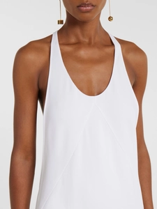 Elegant white halter neck dress with deep U-neckline and geometric pleated detail
