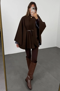 Detail of dark brown wool cloak coat with gold buttons and slim leather waist belt