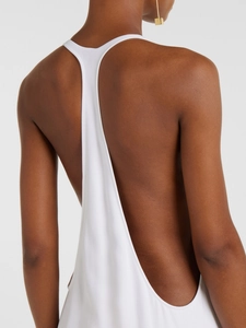 Elegant white backless halter dress featuring minimalist design and open back detail