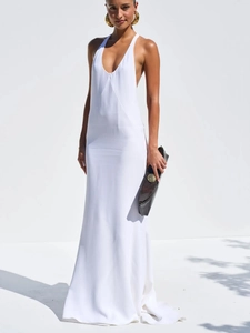 Elegant white halter neck backless long dress with V-neckline and flowing floor-length hem