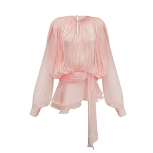 Detailed view of light pink pleated blouse with waist tie and lantern sleeves on white background