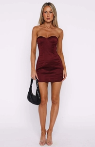 Detail of burgundy satin tube dress featuring corset-style boning and slim fit design