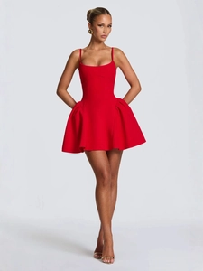 Chic red strapless mini dress with spaghetti straps and pleated puffy skirt silhouette