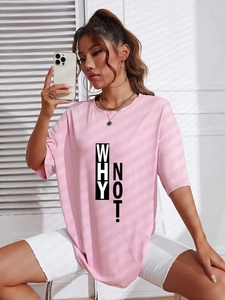 Detail of pink cotton oversized T-shirt featuring bold black WHY NOT slogan print