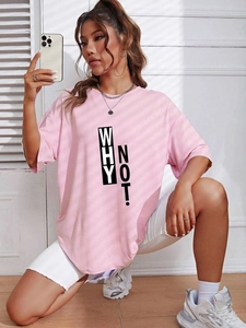 Detail of pink loose fit t-shirt featuring 'WHY NOT!' print and dropped shoulders design