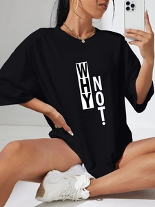 Detailed close-up of 'WHY NOT!' white text print on a black loose cotton t-shirt for women