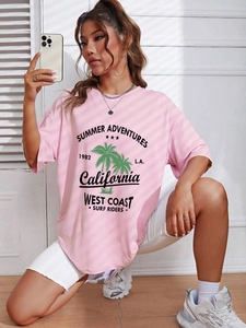 Detail view of pink loose fit cotton t-shirt featuring California summer themed graphic print