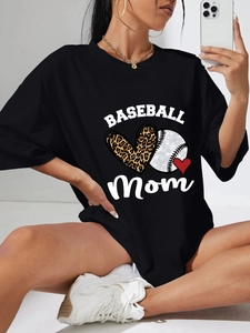 Detail shot of Baseball Mom print with leopard heart on black loose cotton t-shirt