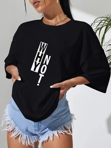 Detail of oversized black t-shirt with 'WHY NOT!' print and drop shoulder design