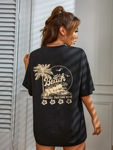 Women's loose black cotton t-shirt with tropical palm island print on the back