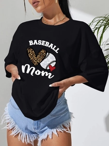 Detail of loose fit black t-shirt featuring artistic Baseball Mom leopard heart print