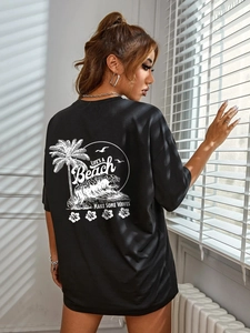Women's black oversized T-shirt with vintage white beach print on back and loose fit cut