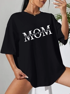 Close-up of black cotton mom t-shirt featuring personalized names and heart print detail