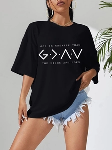 Detail of oversized black t-shirt with white 'God Is Greater' graphic and round neck