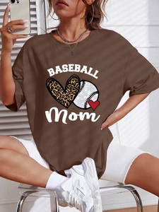 Detail view of the 'BASEBALL Mom' graphic print and leopard heart on the oversized t-shirt
