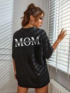 Black oversize women's T-shirt with white MOM back print and names in artistic shadow light