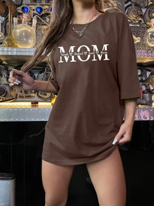 Close-up of brown oversized cotton T-shirt featuring personalized MOM graphic print