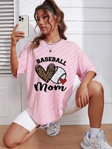 Close-up of pink cotton T-shirt featuring baseball heart print and Mom text detail