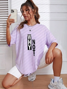Detail of purple loose-fit T-shirt featuring Why Not! lettering and casual street style