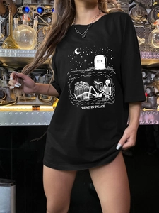 Detail of loose black T-shirt with white skeleton reading graphic and text print