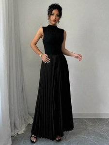 Elegant sleeveless pleated maxi dress with a standing collar in solid black color