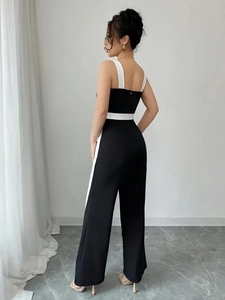 Women's backless jumpsuit with black and white contrast and wide leg design