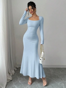 Detail of light blue ruched long sleeve dress featuring an elegant square neckline design
