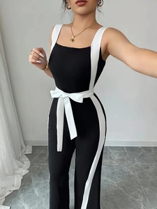 Women's black and white contrast jumpsuit with sleeveless U-neck and bow tie waist