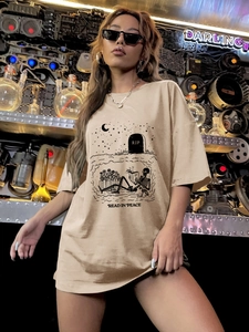 Oversized khaki crewneck T-shirt with black skeleton print and Read in Peace text graphic