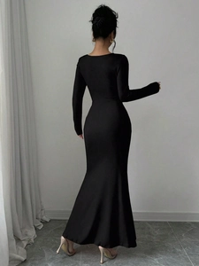 Back view of elegant black long sleeve mermaid dress showing slim fit silhouette