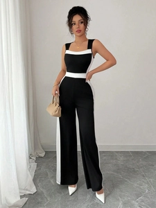 Elegant sleeveless wide-leg jumpsuit with black and white color-block design