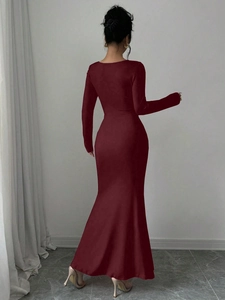 Elegant burgundy long sleeve fishtail dress showing back silhouette and slim fit design