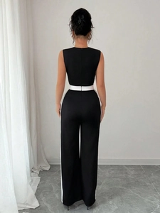 Elegant sleeveless black wide-leg jumpsuit with white side stripes and back zipper